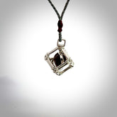 Red Jasper stone heart carving in Sterling Silver surround box. Hand carved for NZ Pacific. Handmade jewellery for sale online. The cord is a 3-braid plait in silver grey and is adjustable. Jasper heart necklace for men and women. Heart necklace hand made from Jasper and sterling silver.